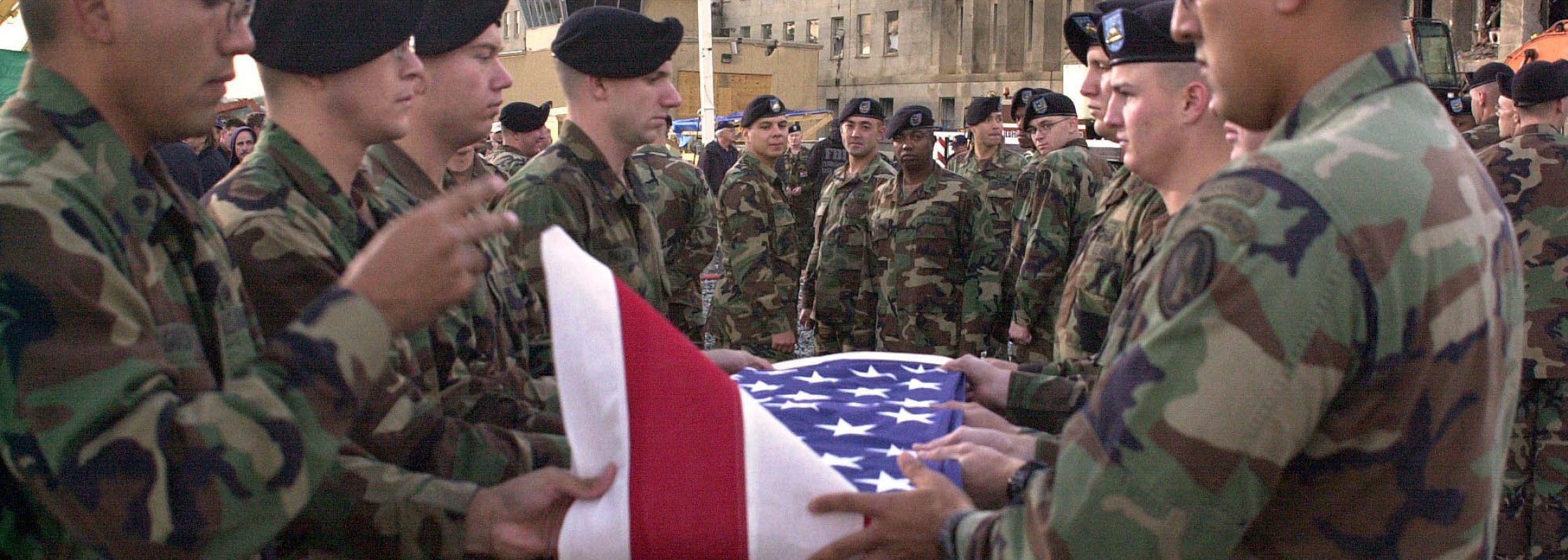 Image of American Soldiers Folding the American Flag During a 9/11 Ceremony